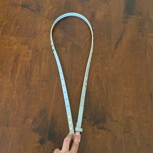 Grey belt with gold accents